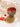 BOLS APÉRITIVO ceramic wine and cheese serving board with wooden handle and rich brown color.