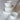 PLATS DE SERVICE - Set of fine white ceramic dinner plates with gold trim and elegant design.