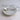 Petite Assiette Dessert - Small ceramic dessert plate with white glaze and delicate floral pattern.