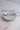 Petite Assiette Dessert - Small ceramic dessert plate with white glaze and delicate floral pattern.
