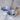 SALADIERS CONIQUES ceramic salad servers with stainless steel handles, silver finish.