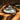 PLATEAUX RONDS ceramic dinner plate with rounded edges, white glaze, and a modern design.